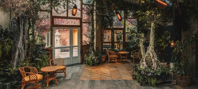 Aquarium Room at Comptoir General: lush greenery, cozy venue for events and gatherings.