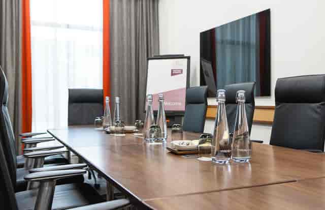 Meeting room 1 at Clayton Hotel Leeds with polished table, ideal for conferences and meetings.
