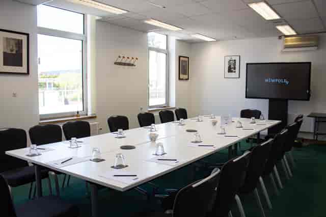 Wigmore Room meeting setup with natural light, ideal for professional events and presentations.