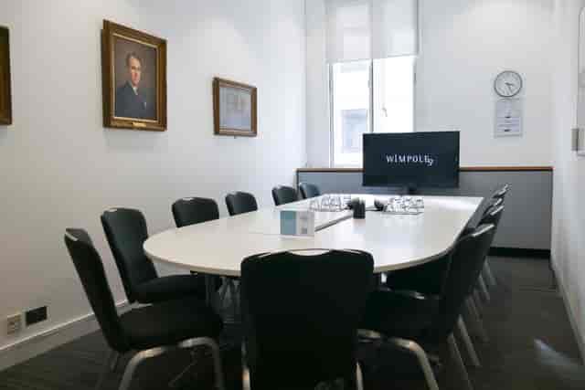 Modern Library Boardroom with oval table, ideal for professional meetings and presentations.