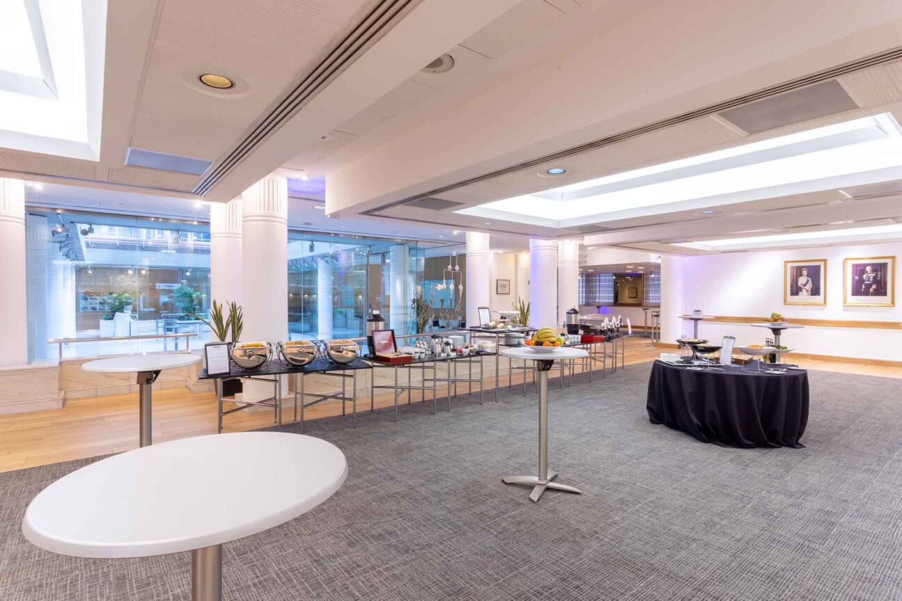 Cavendish Room event space with high-top tables, perfect for meetings and receptions. - Banner