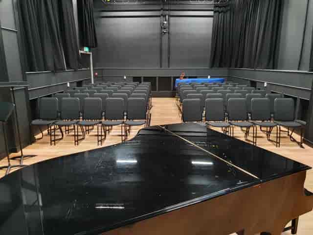 Performance Studio at Royal College of Music with grand piano, ideal for concerts and presentations.