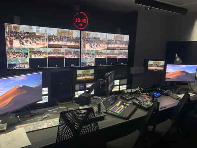 Modern control room at Belle Shenkman Studio for live event production with multiple screens.