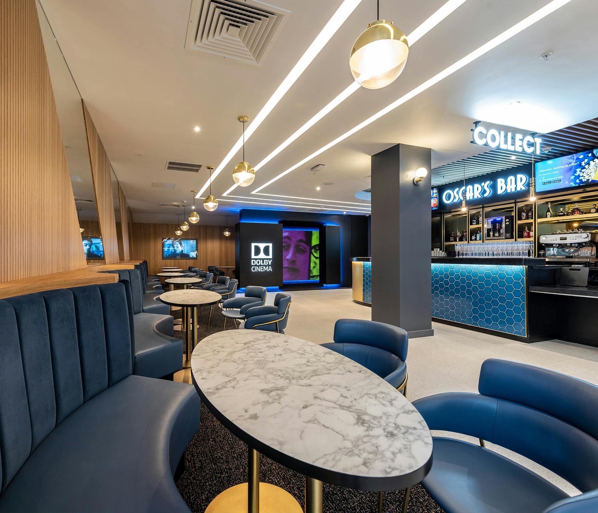 Modern event space at ODEON Luxe West End with stylish seating and bar for networking.