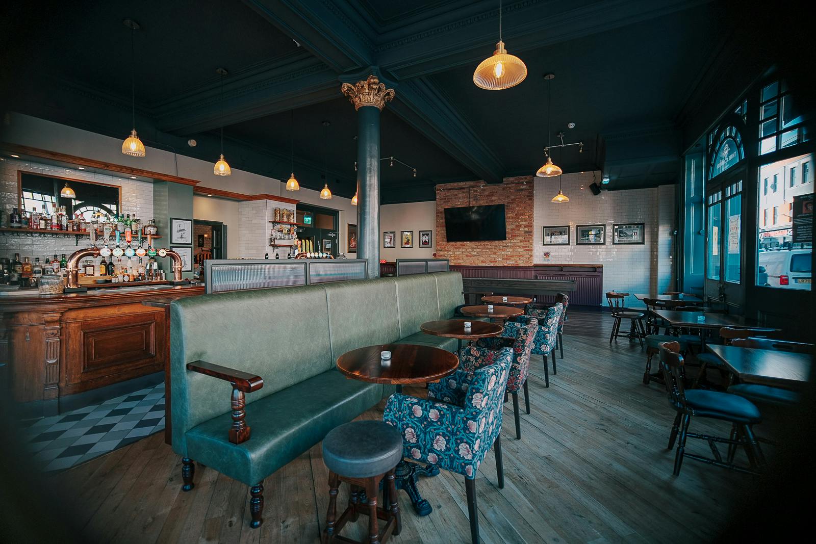 Three Compasses Pub interior with cozy seating, ideal for networking events and gatherings.