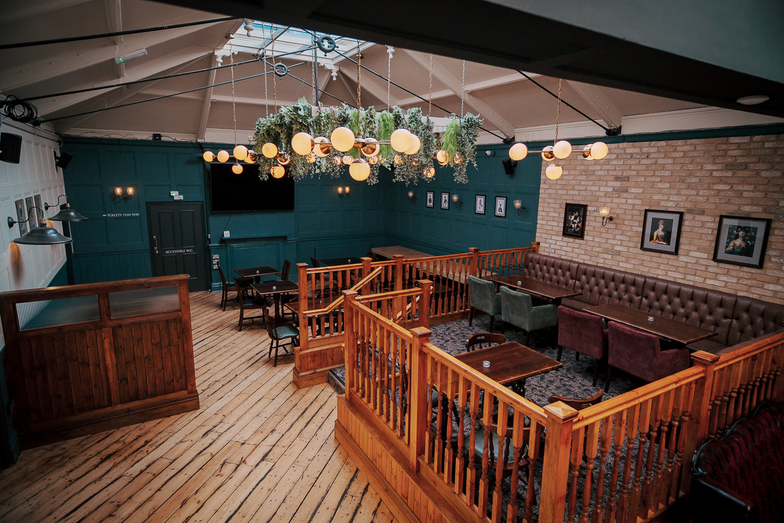 Three Compasses Pub with cozy seating, ideal for networking events and workshops. - Banner