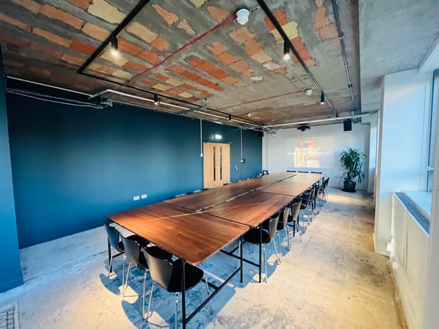 Modern meeting room with wooden table, ideal for workshops in FACTORY 15 Barking.