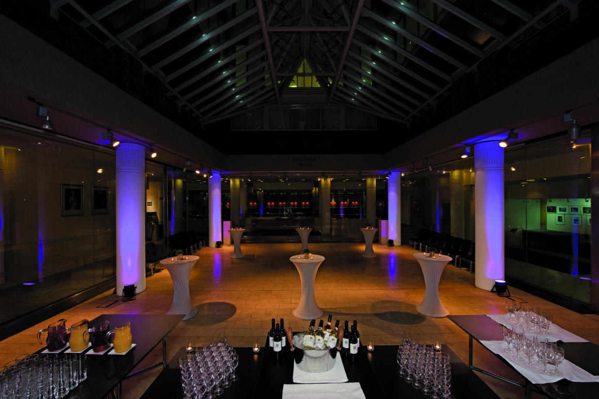 Max Rayne Atrium event space with elegant cocktail tables for upscale receptions. - Banner