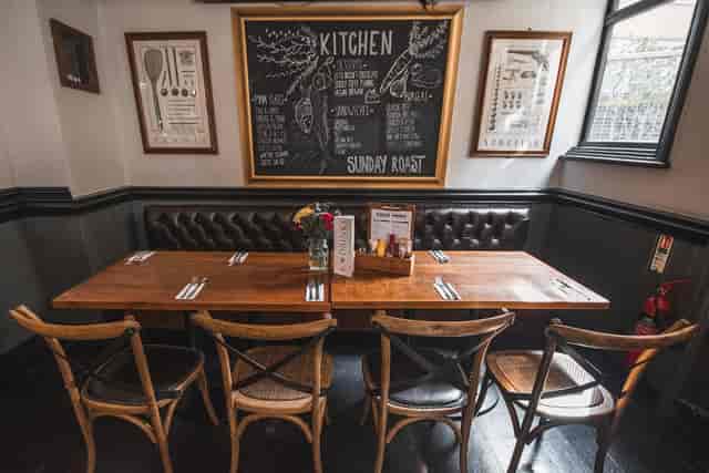 Cozy dining area at St Christopher's Inn, perfect for intimate meetings and events.