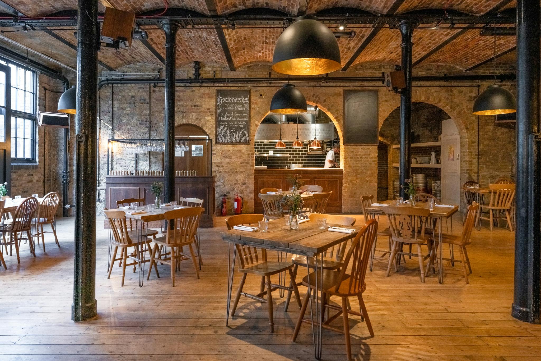 Stylish rustic dining room with warm wood tones for intimate gatherings and corporate events.