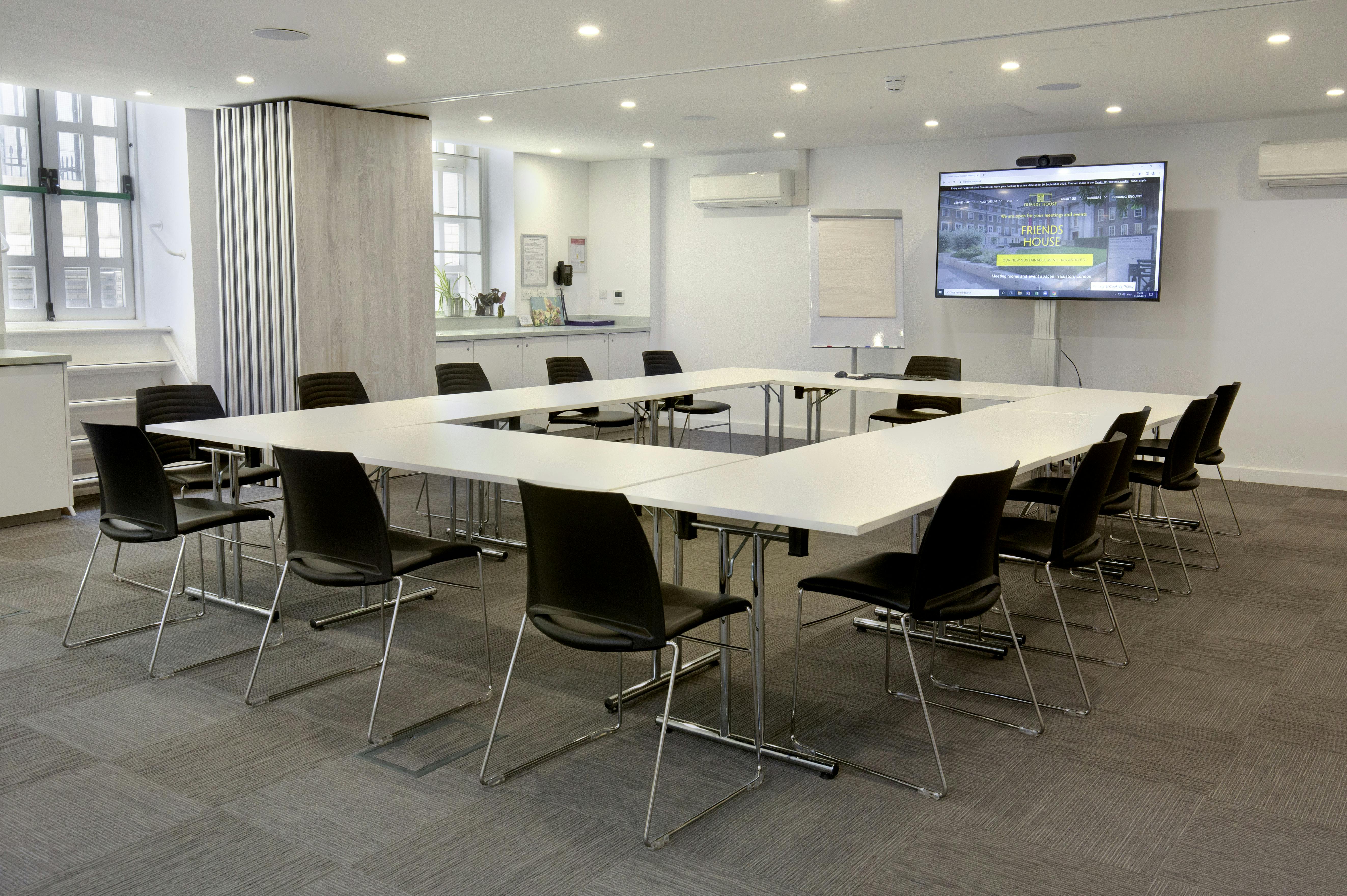 Modern meeting room in Friends House with ergonomic chairs for workshops and planning.