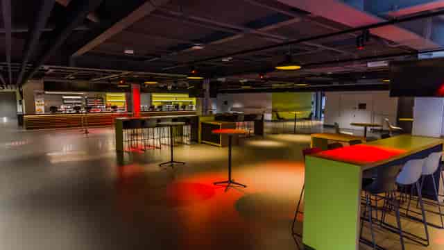 Modern event space at Brentford FC with flexible seating for networking and workshops.