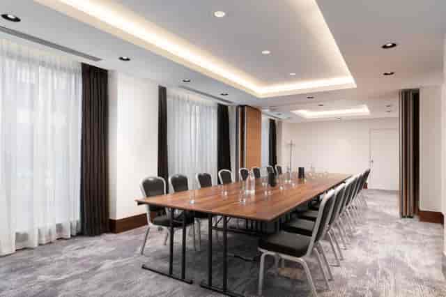 Modern Mezzanine Meeting Room at Hilton London Metropole, ideal for professional gatherings.