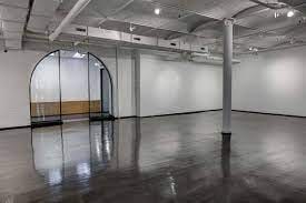 Spacious event space with polished floors, ideal for corporate meetings and social gatherings.