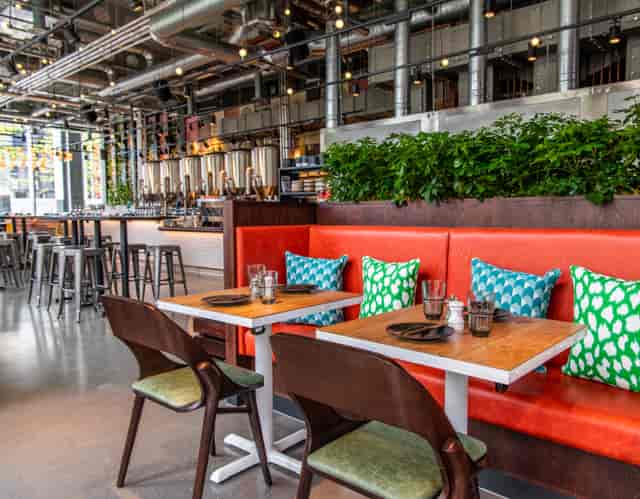 Modern dining space at Babel Beerhouse, perfect for networking events and casual meetings.