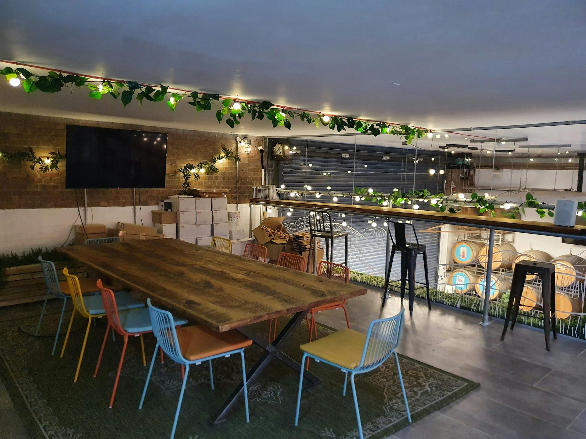 Treehouse Tasting Room with wooden table, ideal for corporate events and workshops.