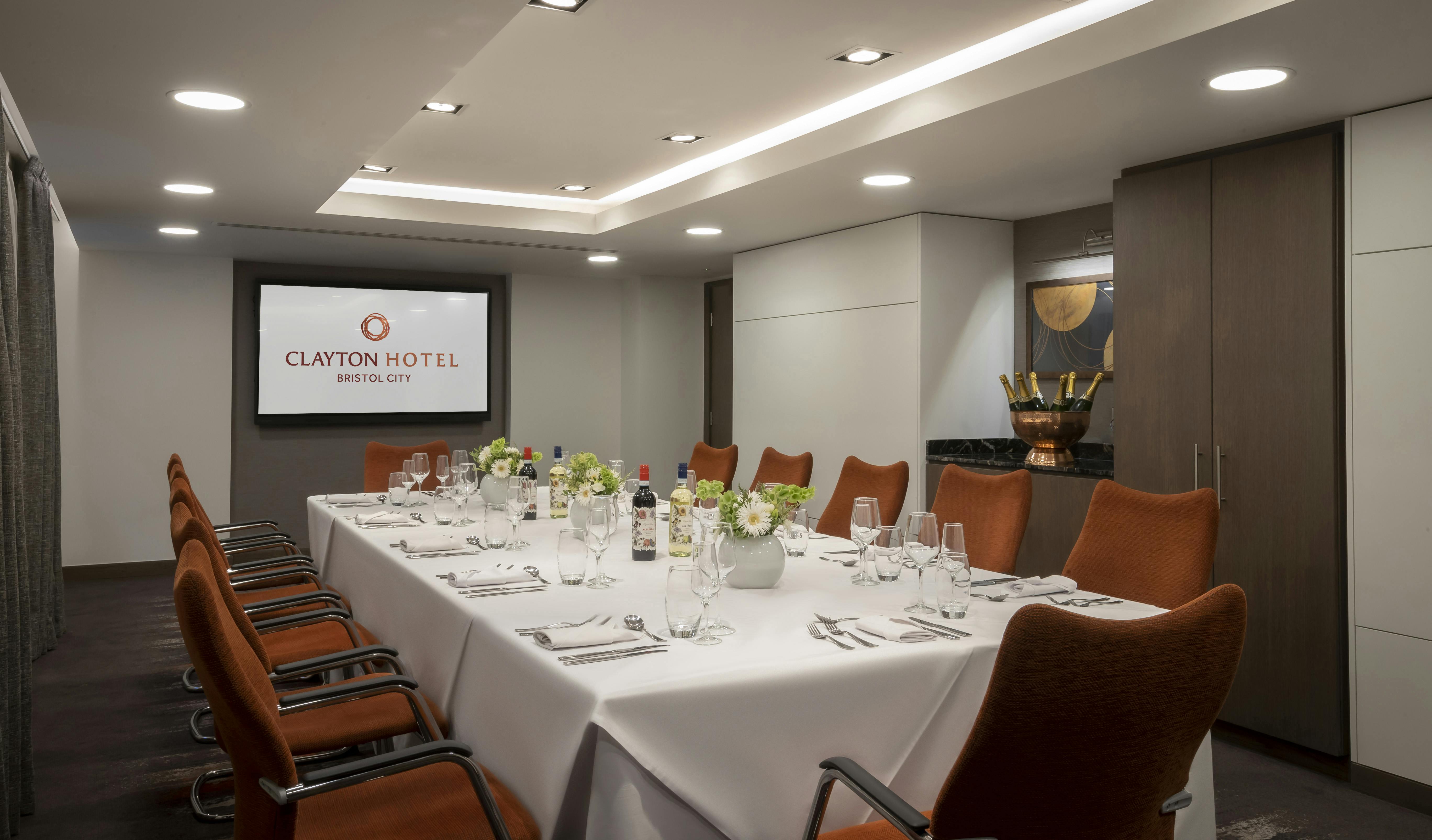 Modern meeting room at Clayton Hotel Bristol for corporate events with elegant table setup.