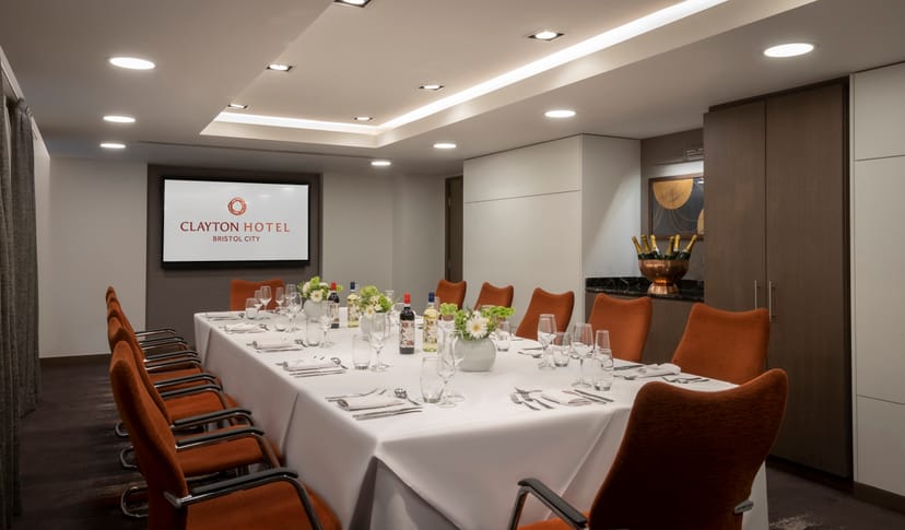 Modern meeting room at Clayton Hotel Bristol for corporate events with elegant table setup.