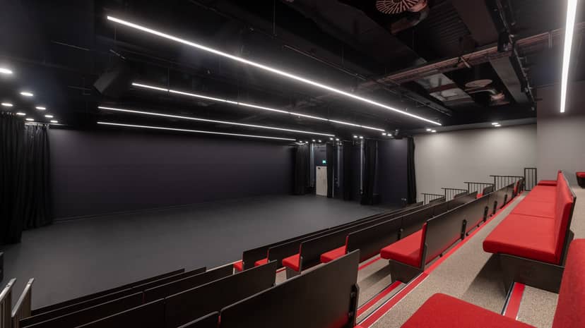 Aud Jebsen Studio Theatre with tiered seating for versatile corporate and creative events.