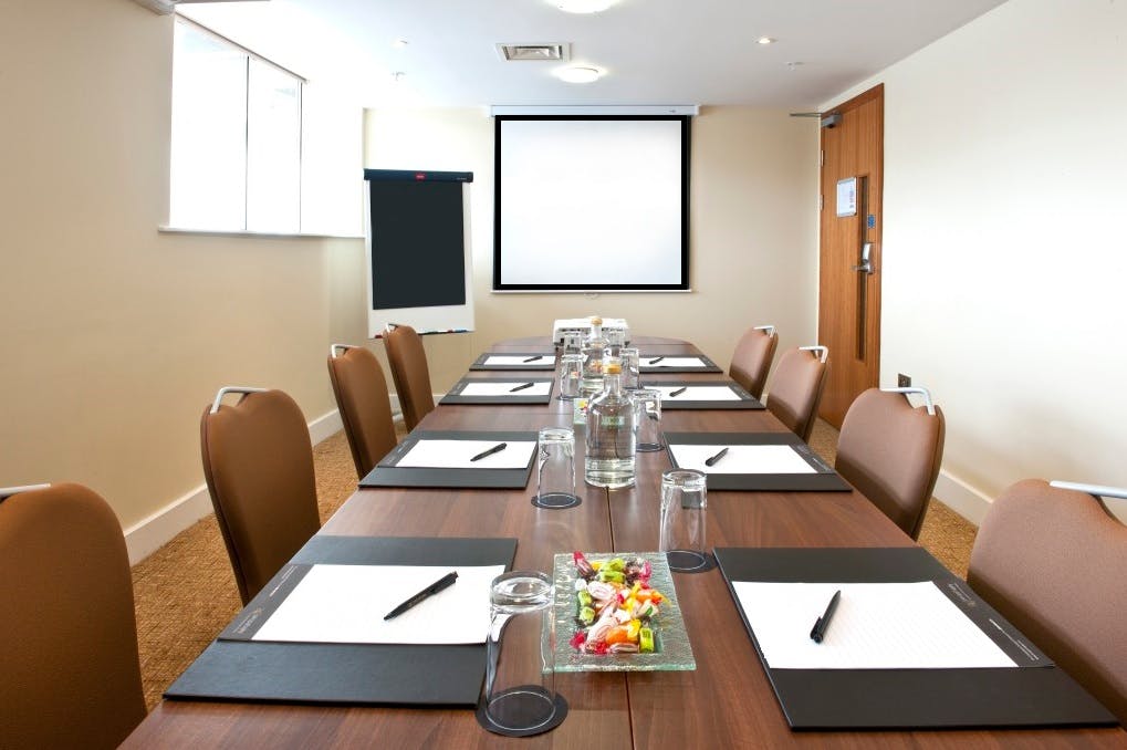 Meeting room in Voco St David's Cardiff, set for professional gatherings and presentations.