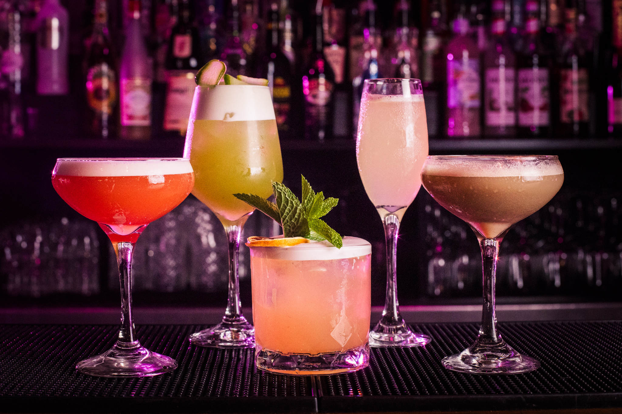 Vibrant cocktails in elegant glassware for sophisticated cocktail receptions. - Banner