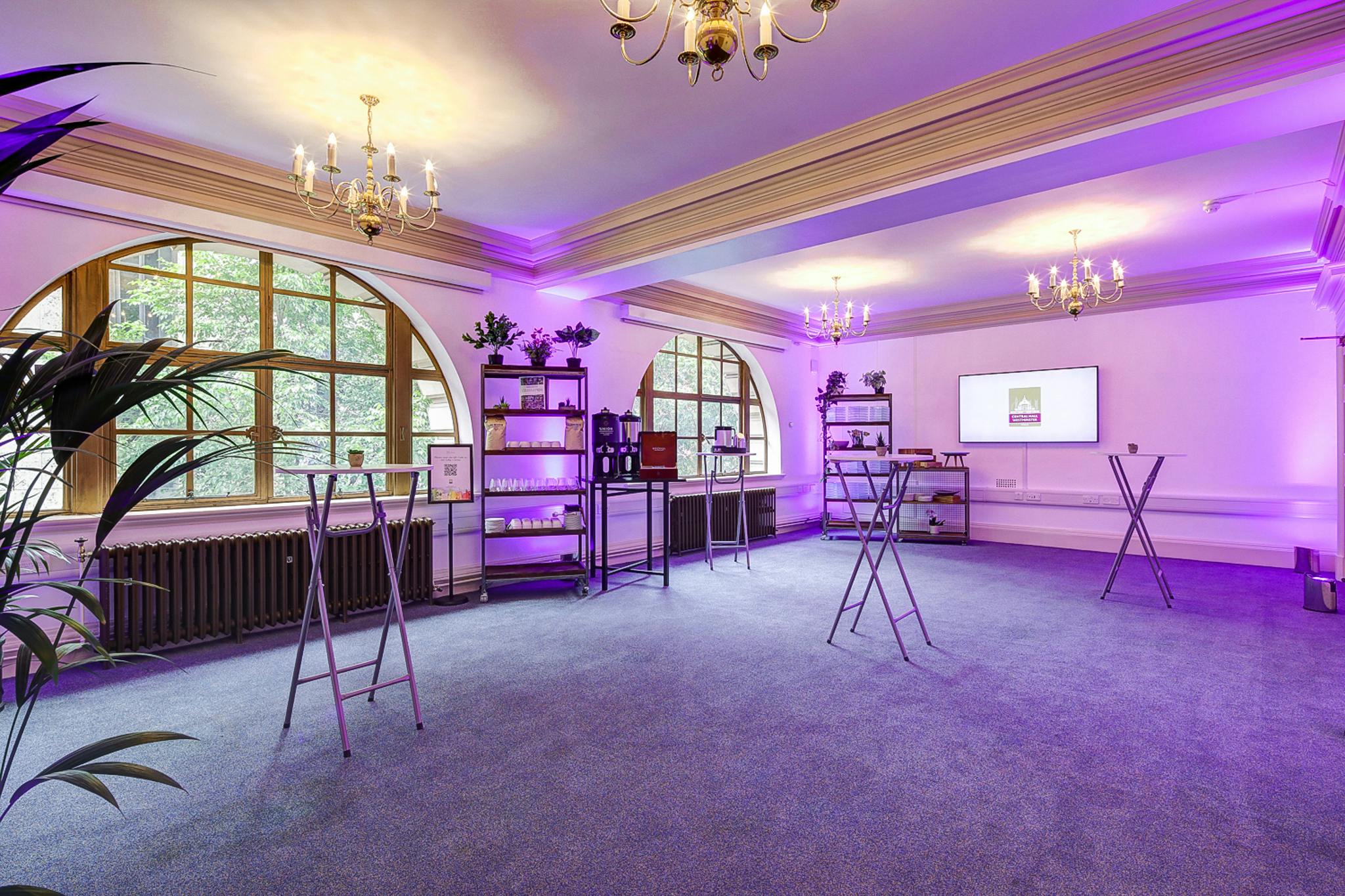 John Tudor in Central Hall Westminster, elegant chandeliers, versatile event space.