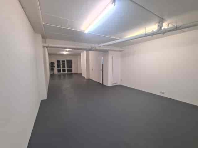 Large Gallery Room at B. T. Batsford: versatile event space with natural light for meetings.