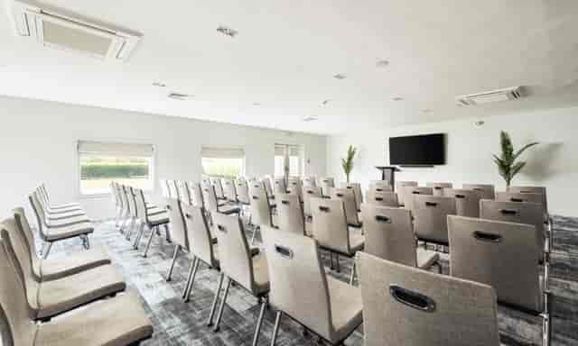 The Waterfront Hotel meeting space with chairs, ideal for corporate events and workshops.