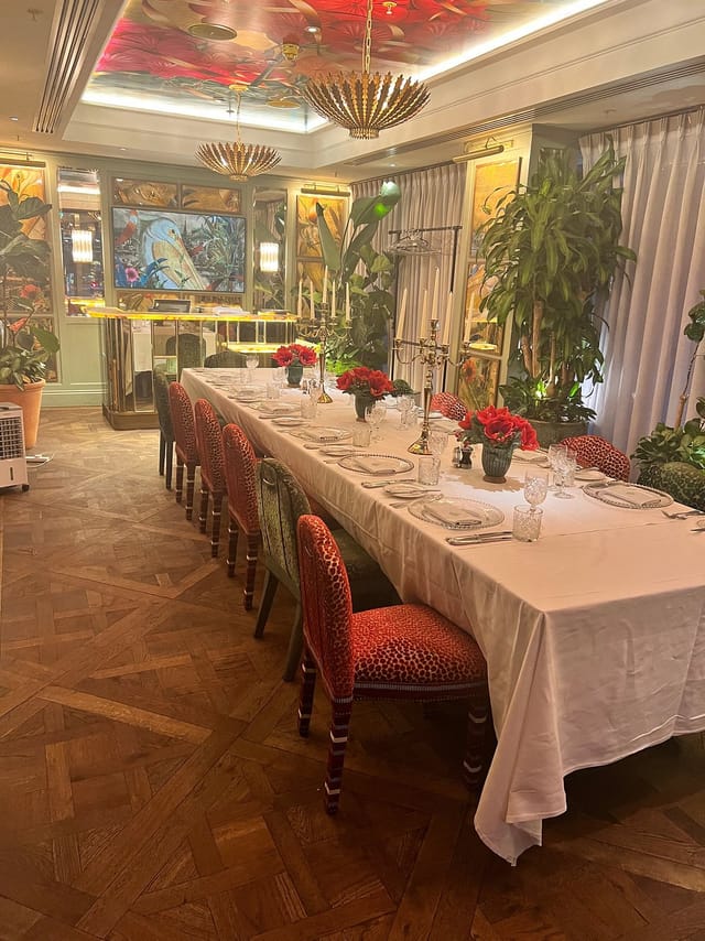 Elegant dining table with floral centerpieces in The Pelican Room, Ivy Victoria event space.