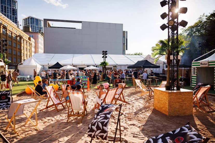 City Beach London: vibrant outdoor event space with sandy ground for summer parties.