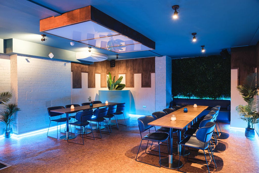 Modern event space with ambient lighting for meetings and social gatherings in Liverpool.