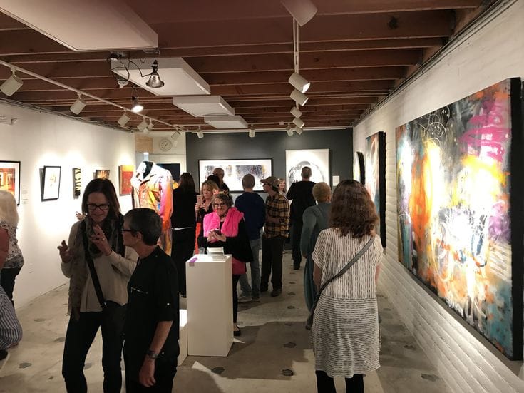 Vibrant art gallery event with diverse artworks, perfect for networking and creativity.