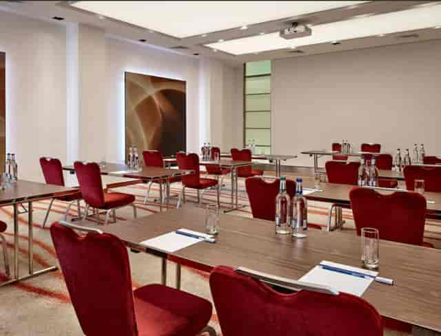 Victoria Suite meeting room in Park Plaza Victoria London, featuring elegant red chairs.