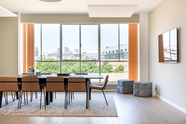 Modern Menier Meeting Room with large windows for productive meetings and brainstorming.