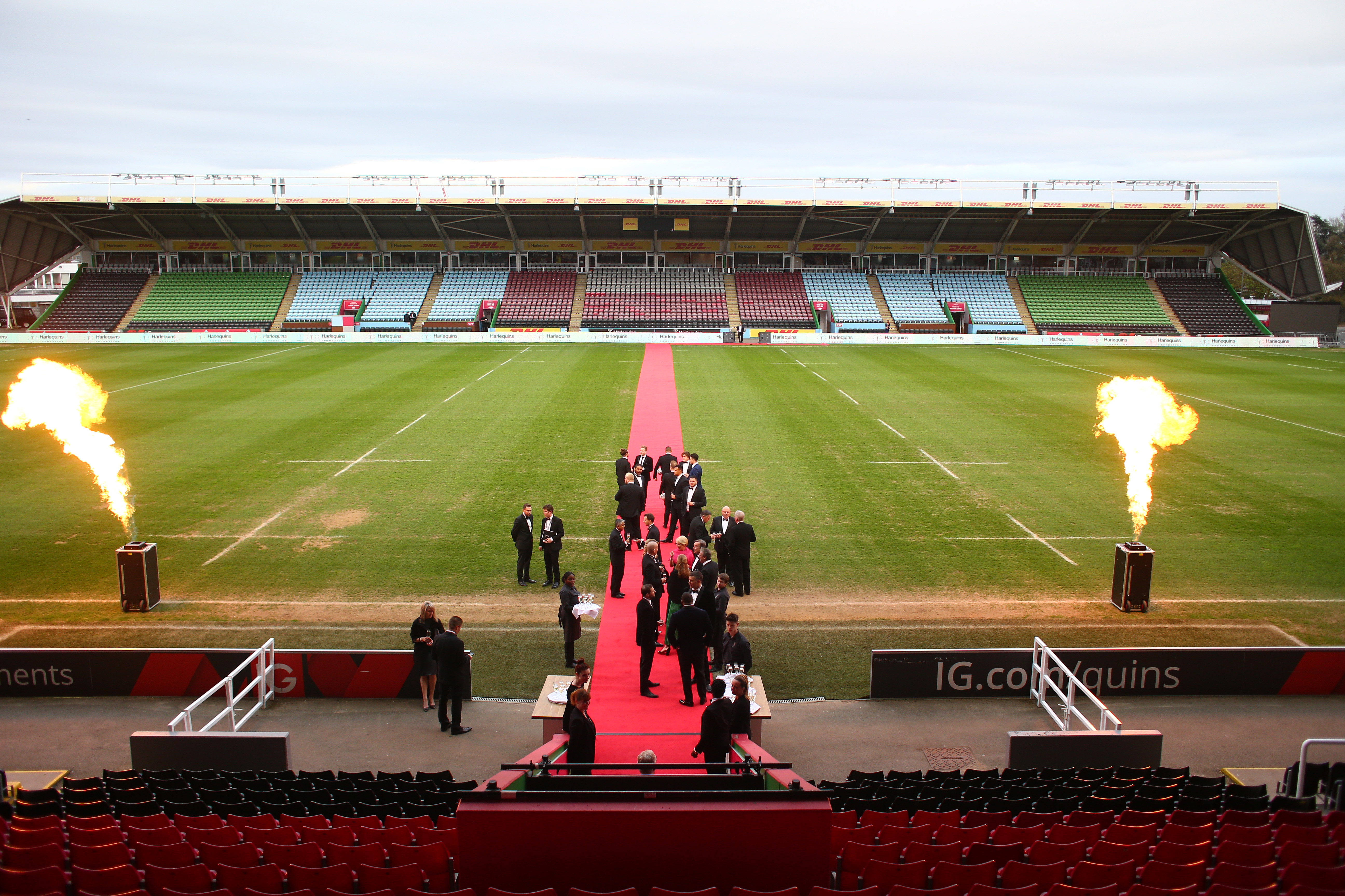 Outdoor event setup at Twickenham Stoop Stadium with red carpet and flame effects. - Banner