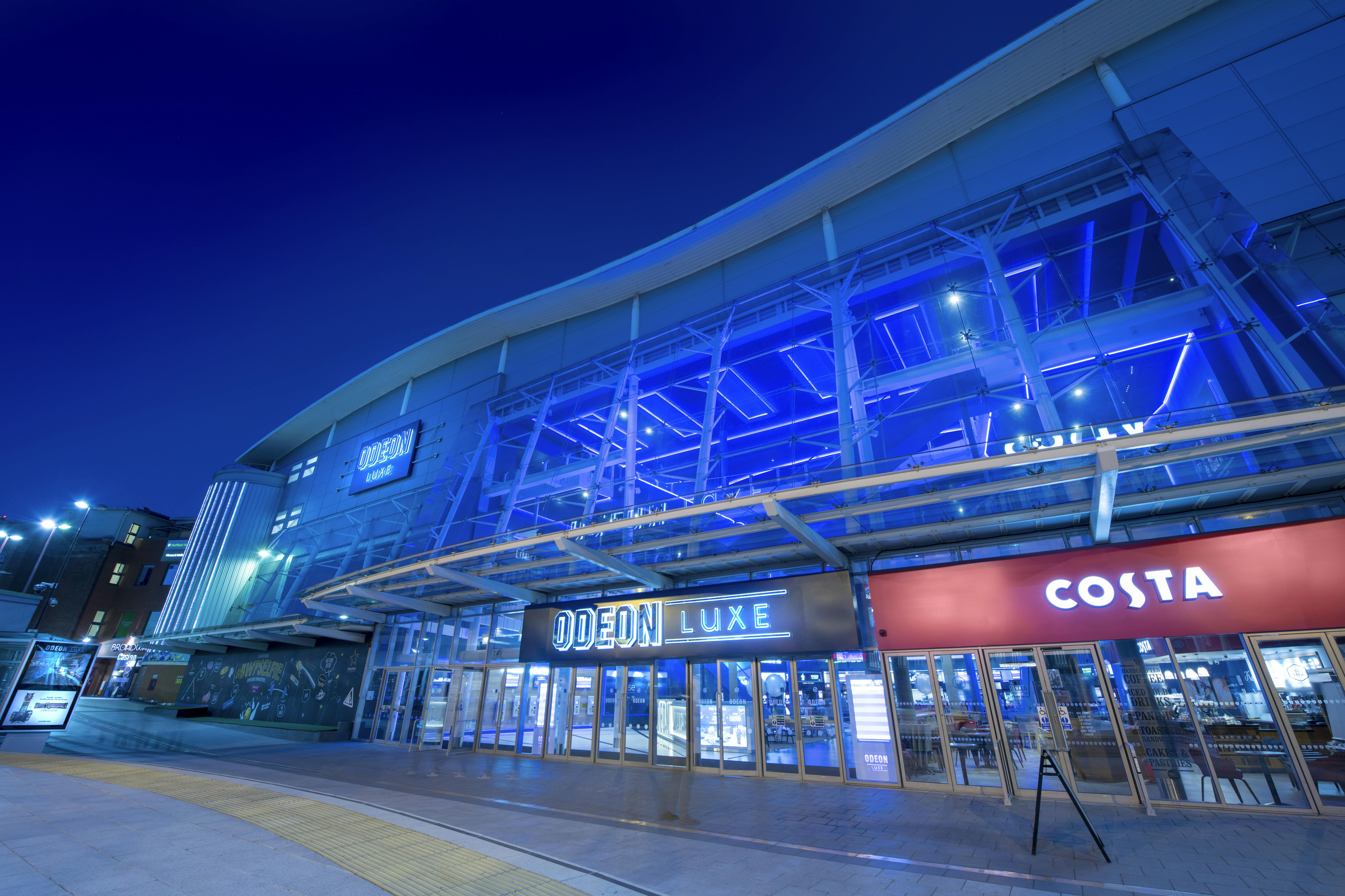 Modern ODEON LUXE Birmingham bar with illuminated facade, perfect for events and gatherings.