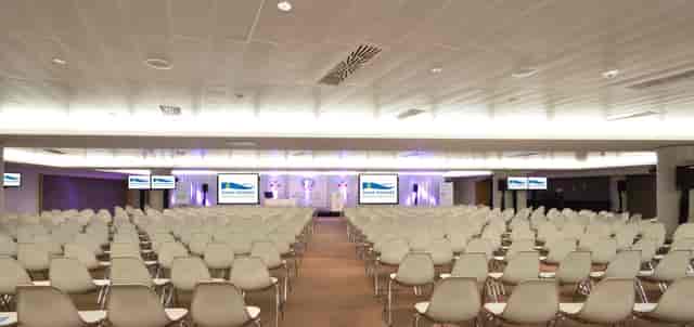 Presidents Suite at Aviva Stadium, spacious conference room for events with white chairs.