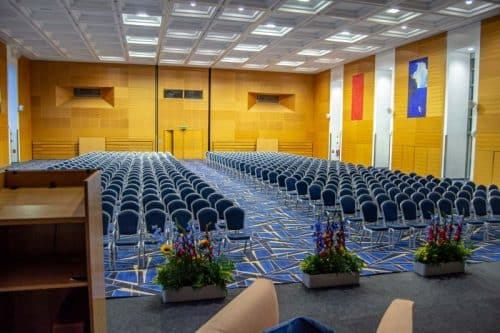 O'Reilly Hall conference room with blue chairs, ideal for presentations and seminars.