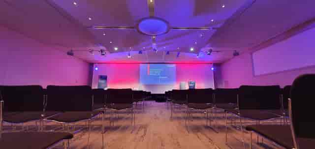 Conference room in Grands Causses, Aveyron with sleek chairs and ambient lighting.