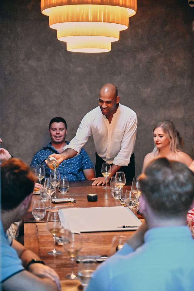Intimate dining setup with attentive service for networking events and private dinners.