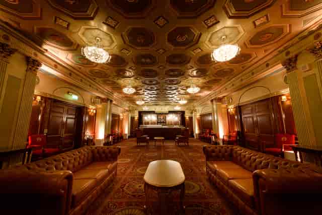 Elegant Livery Hall gala event, opulent ballroom, ornate ceiling.