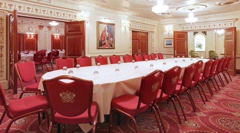 Humber Room at Plaisterers’ Hall: elegant meeting space with red chairs, ideal for events.