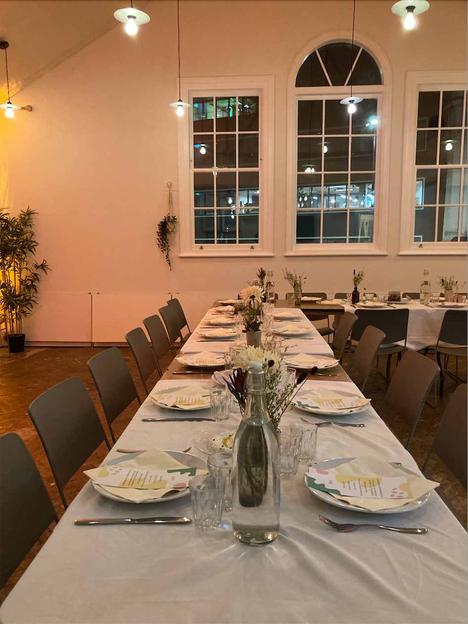 Elegant dining setup in King's House for memorable events with floral centerpieces.