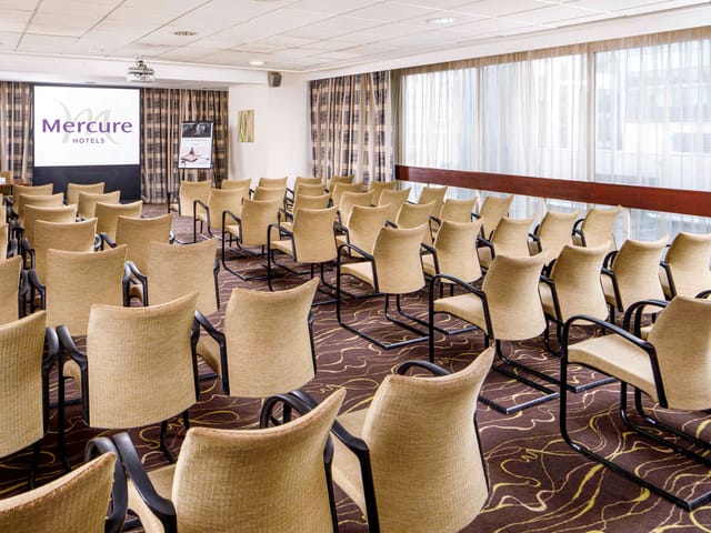 International Suite meeting room at Mercure Manchester, bright space for presentations.