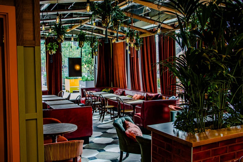 Stylish event space with cozy seating and vibrant decor for networking events.