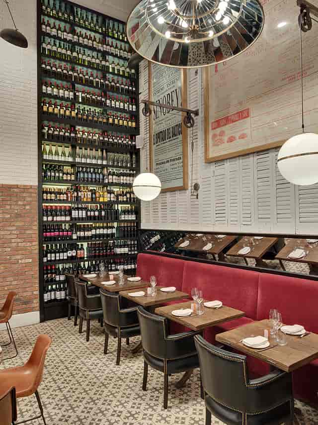 Vinoteca Ibérica Canary Wharf: Corporate dining venue with floor-to-ceiling wine display.