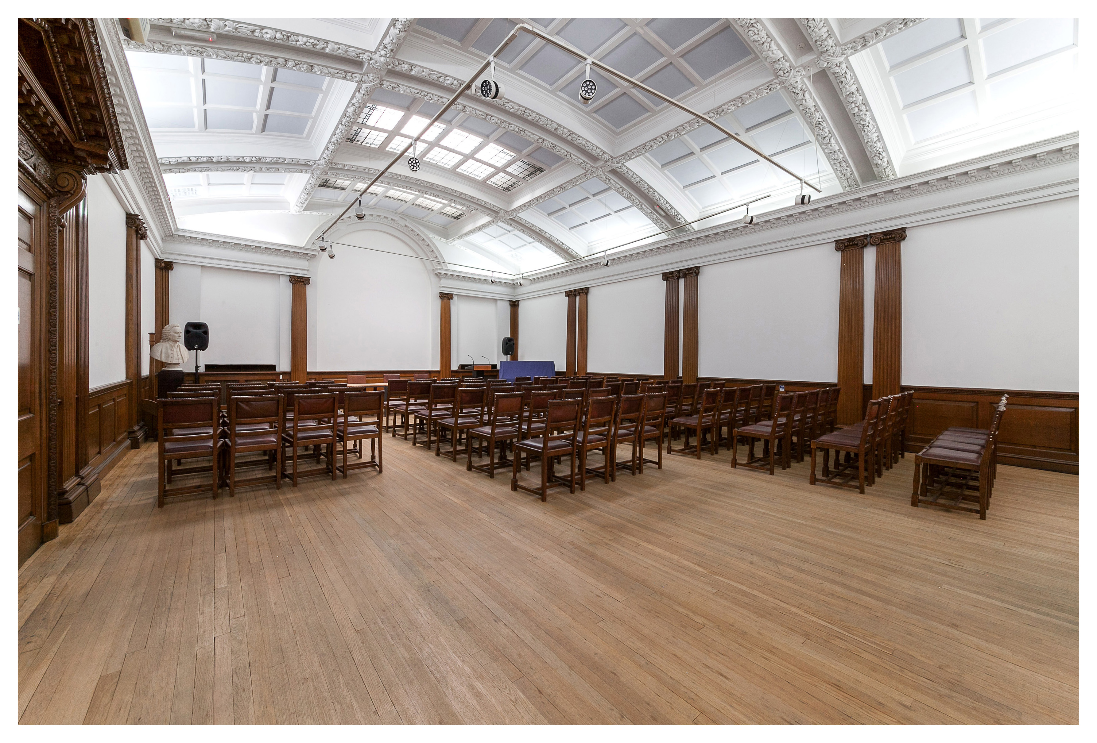 Spacious Swedenborg Hall meeting room with wooden accents for corporate events and workshops.