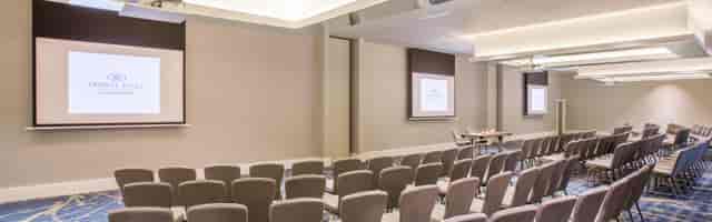 Gerrards Suite meeting room with chairs and screens, perfect for conferences and workshops.