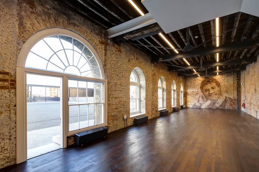 Spacious Knight Gallery venue with exposed brick, ideal for corporate and creative events.