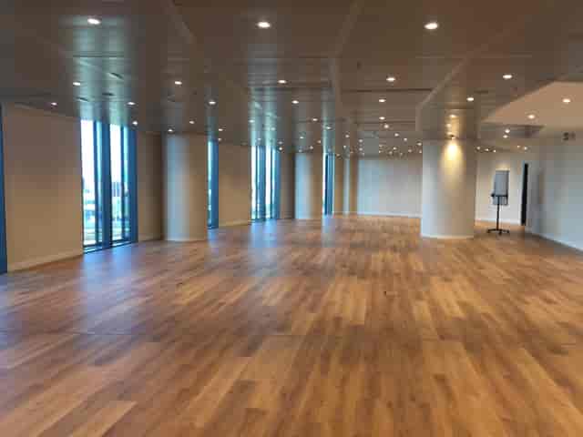 Spacious Amsterdam event venue with large windows for conferences and gatherings.